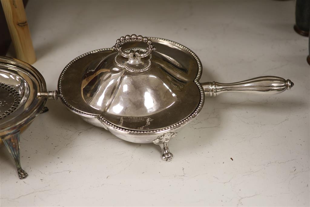 A good quality late 19th century silver-plated warming dish, of clover form, with a shaped cover,